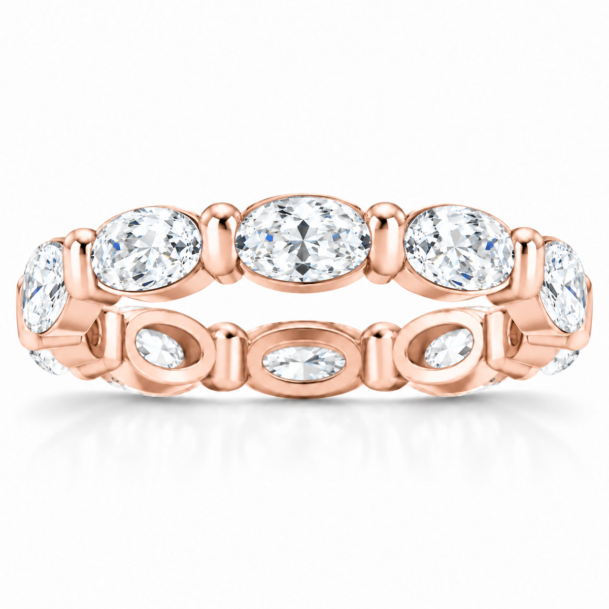 East-west oval shared-prong lab-grown diamond eternity band, 5 x 3 mm diamonds, 14K rose gold, front studio view