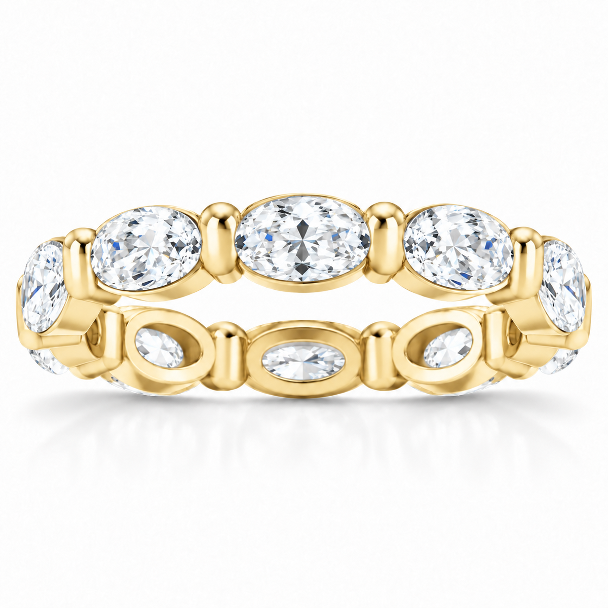 East-west oval shared-prong lab-grown diamond eternity band, 5 x 3 mm diamonds, 14K yellow gold, front studio view