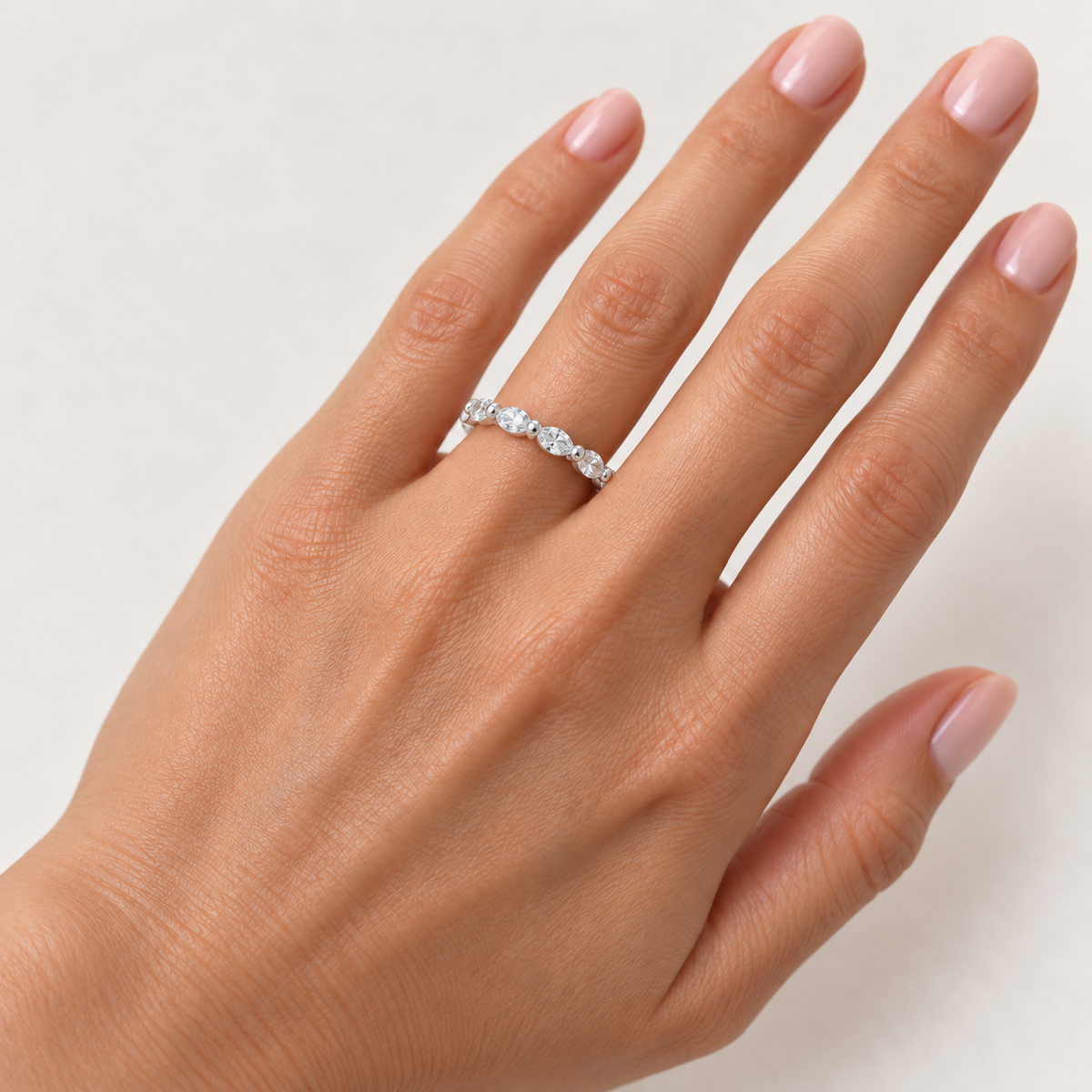 East-west marquise two-prong lab-grown diamond eternity band, 3.5 x 1.75 mm diamonds, 14K white gold, hand view
