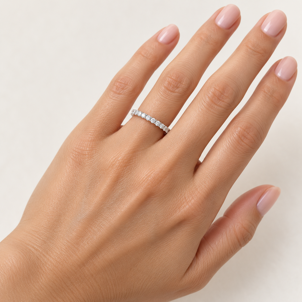 Round two-prong lab-grown diamond eternity band, 1.5 mm diamonds, white metal, hand view