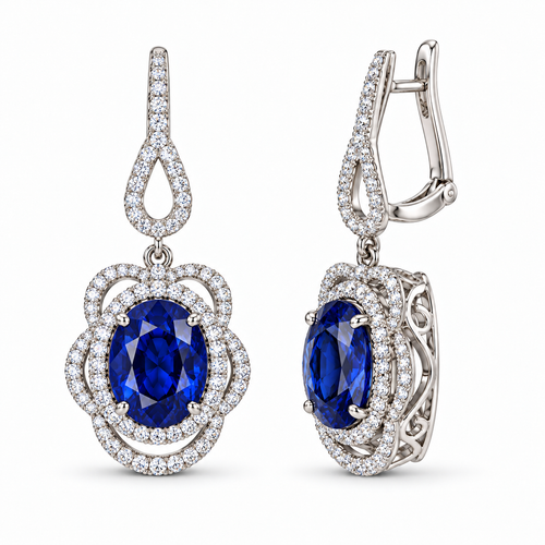 Oval blue sapphire and diamond drop earrings on white background