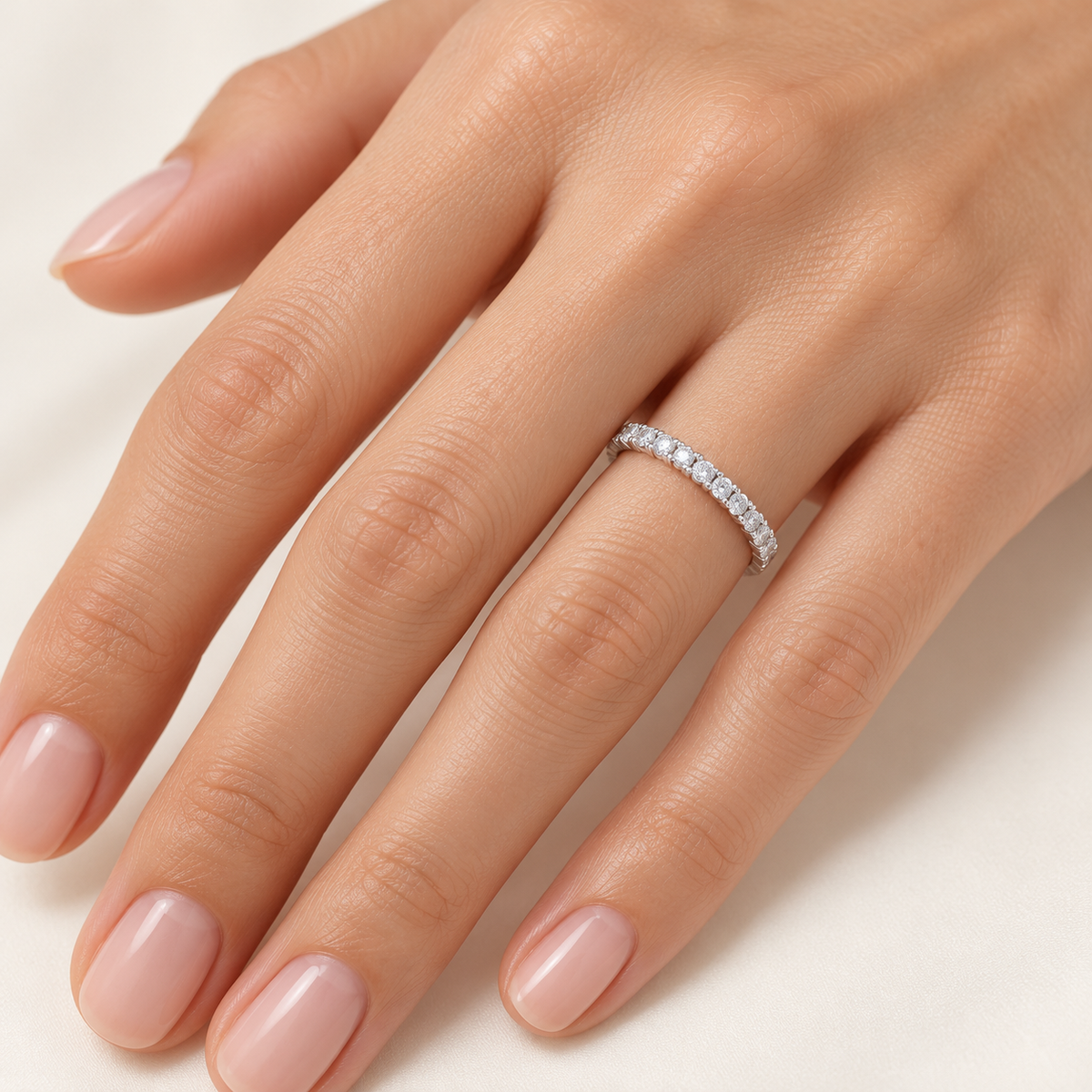 Round shared-prong lab-grown diamond eternity band - 14K White Gold - 1.5 mm diamonds - on-body hand view