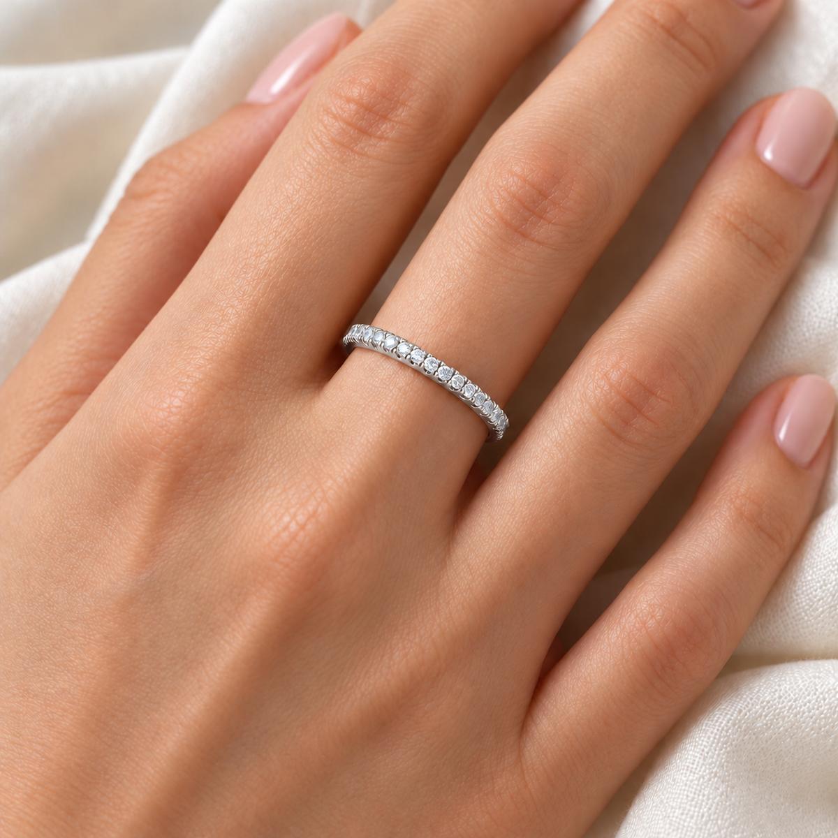 Round split-prong lab-grown diamond eternity band - 14K white gold - 1 mm diamonds - on-body hand view