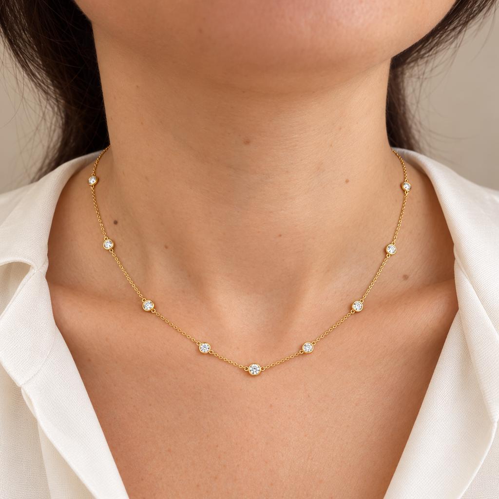 Yellow gold diamond by the yard necklace worn on neck