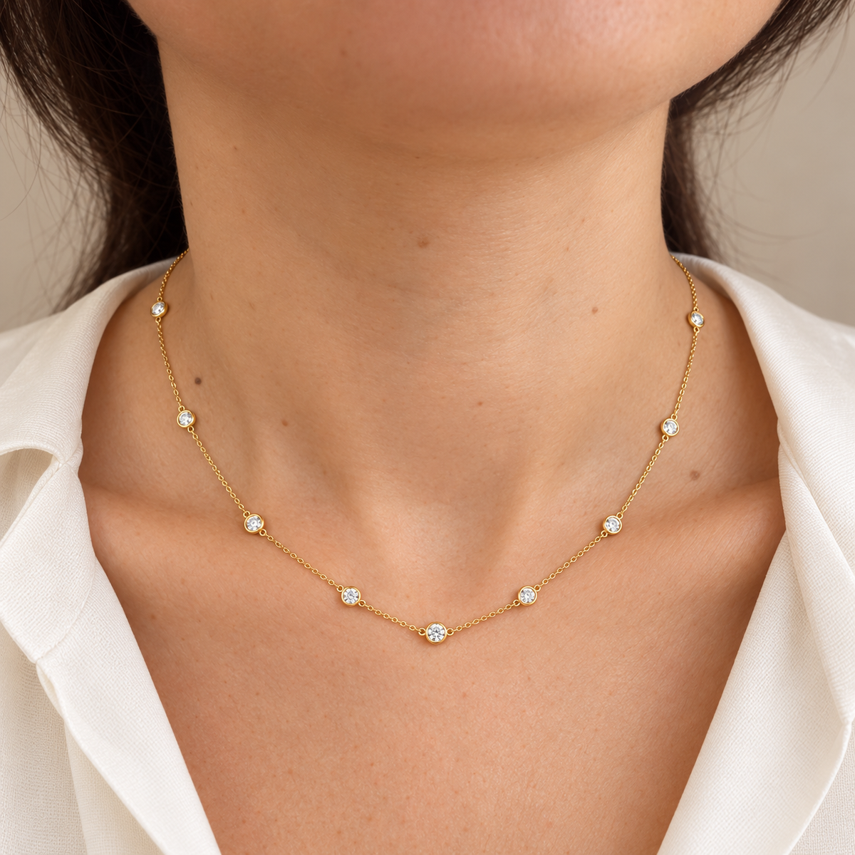 Yellow gold diamond by the yard necklace worn on neck