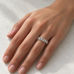14K White Gold oval shared U-prong lab-grown diamond eternity band, 5 x 3 mm diamonds, on-hand view