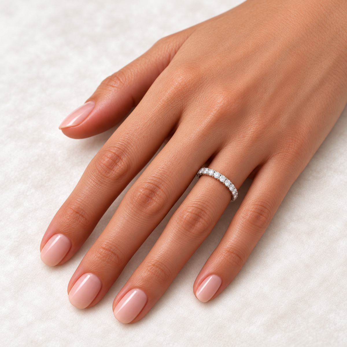 14K White Gold round shared U-prong lab-grown diamond eternity band, 2 mm diamonds, on-hand view