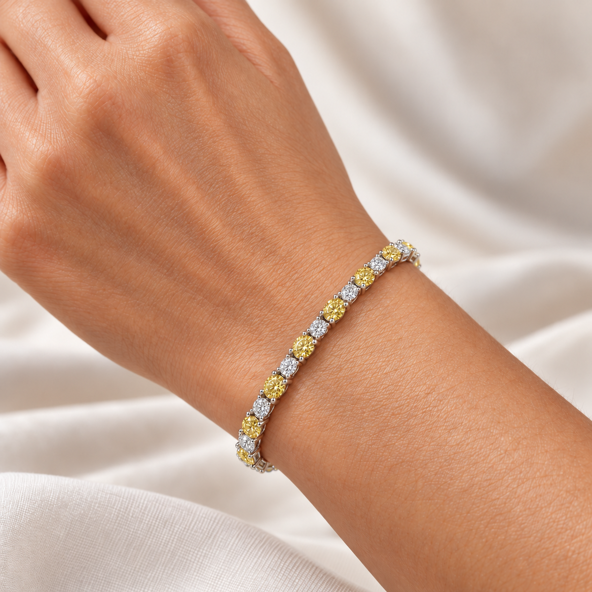 Fancy Vivid Yellow and white lab-grown diamond Plus & Minus bracelet in 14k white gold, 4 mm bracelet shown on wrist