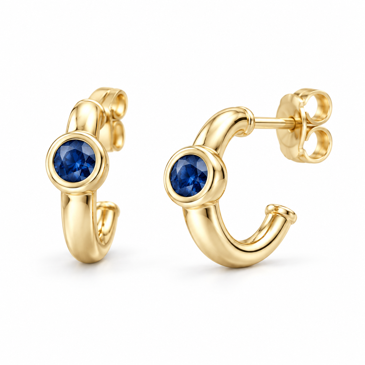 14K Yellow Gold Lab-Grown Blue Sapphire Bezel Huggie Earrings — 3 mm stones — enhanced studio view