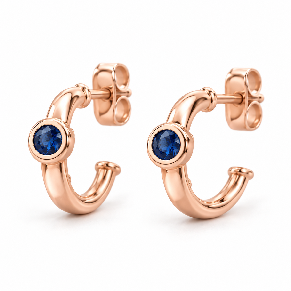 14K Rose Gold Lab-Grown Blue Sapphire Bezel Huggie Earrings — 3 mm stones — enhanced studio view