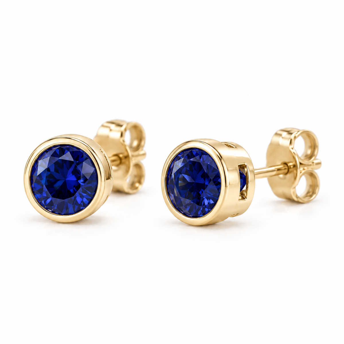14K Yellow Gold Lab-Grown Blue Sapphire Bezel Stud Earrings — 4 mm stones — enhanced studio view