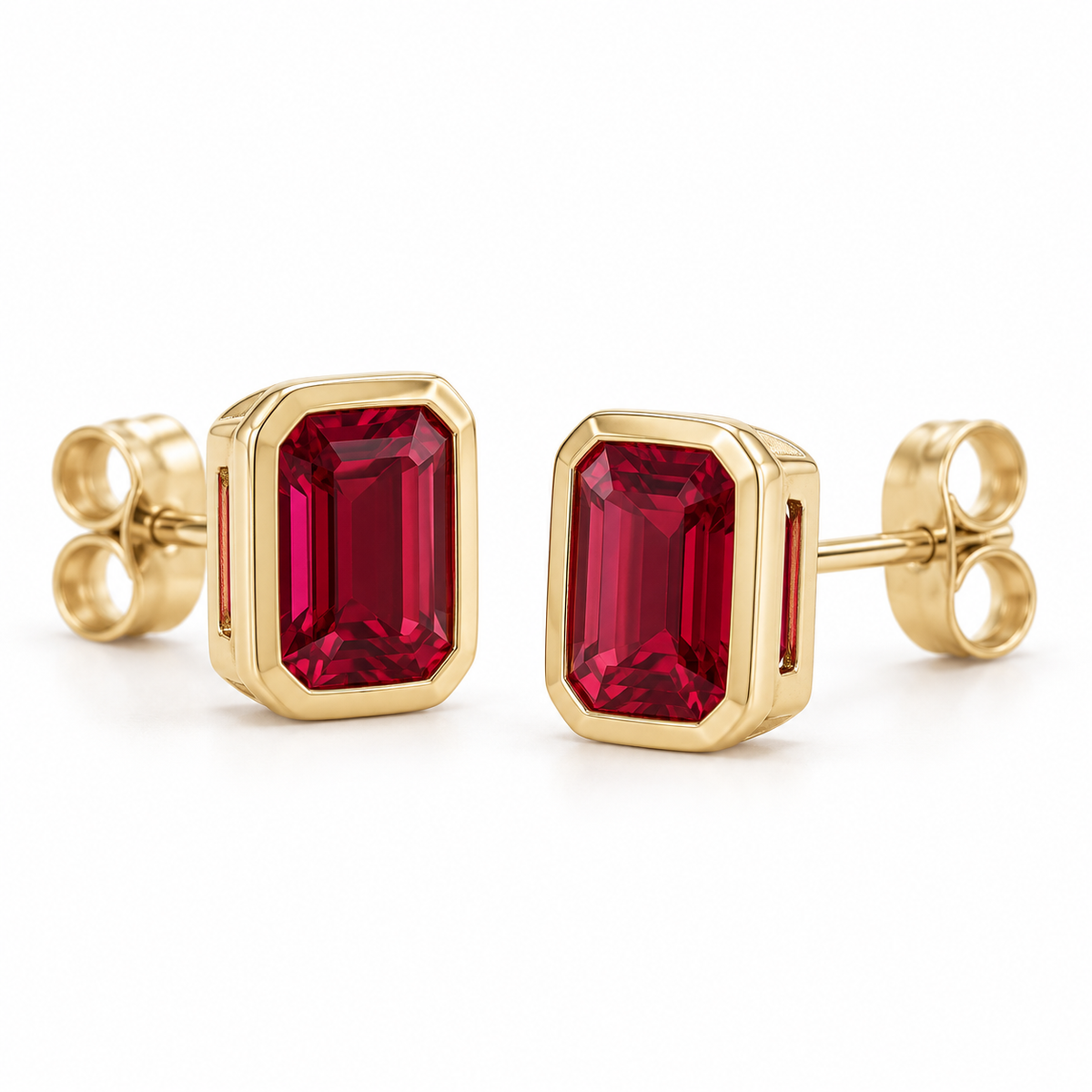 14K Yellow Gold Lab-Grown Ruby Emerald-Cut Bezel Stud Earrings — 6 × 4 mm stones — enhanced studio view
