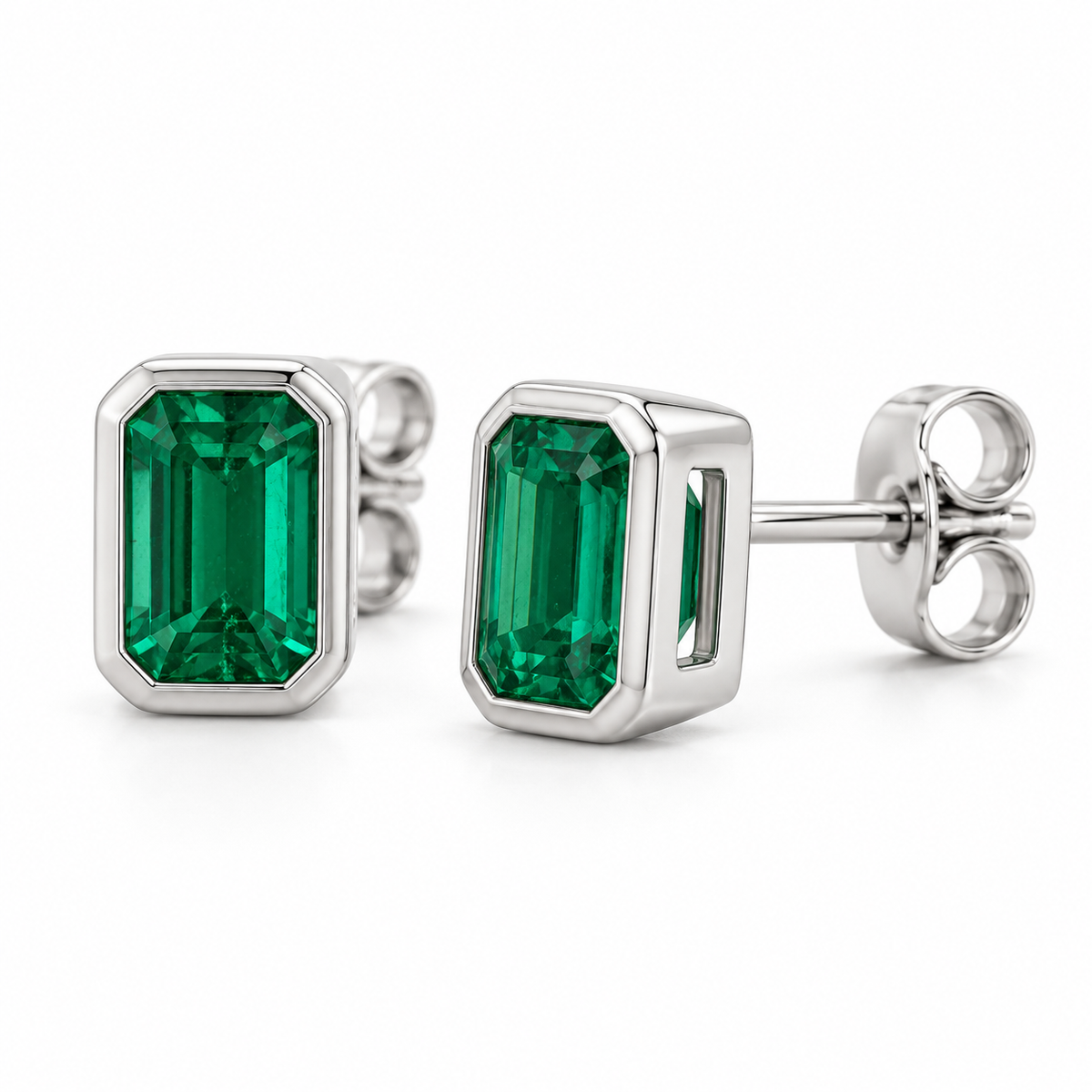 14K White Gold Lab-Grown Emerald Emerald-Cut Bezel Stud Earrings — 6 × 4 mm stones — enhanced studio view