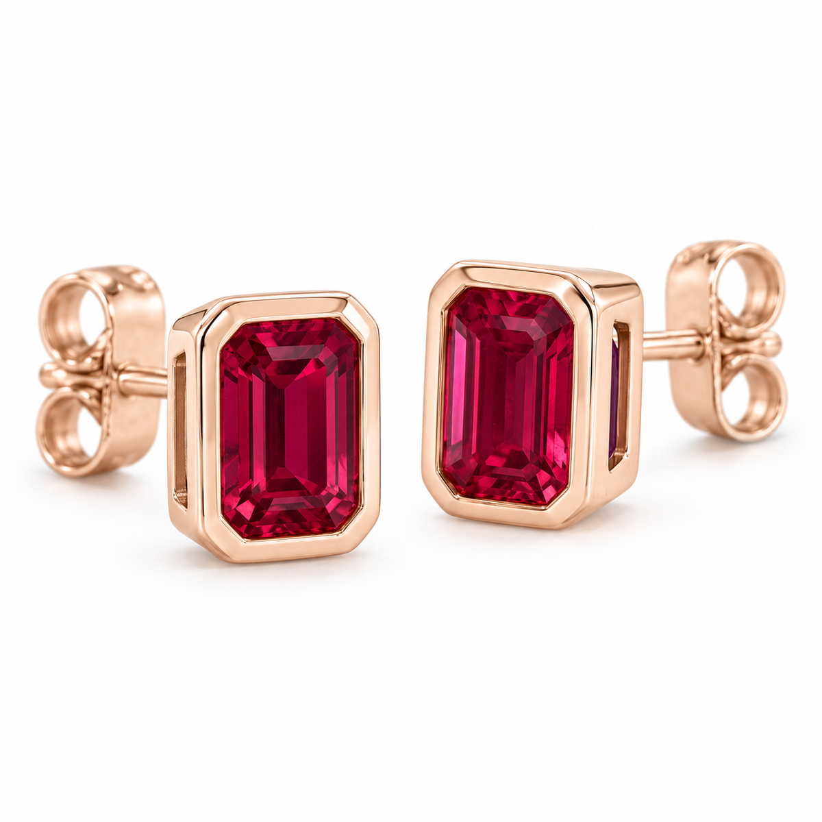 14K Rose Gold Lab-Grown Ruby Emerald-Cut Bezel Stud Earrings — 6 × 4 mm stones — enhanced studio view