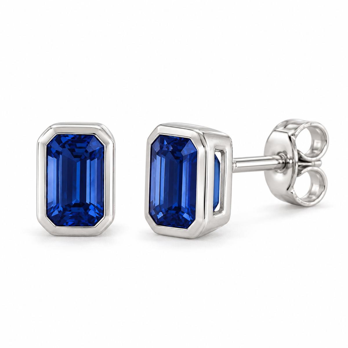 14K White Gold Lab-Grown Blue Sapphire Emerald-Cut Bezel Stud Earrings — 5 × 3 mm stones — enhanced studio view