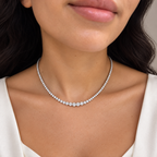 Graduated diamond Riviera necklace worn on neck