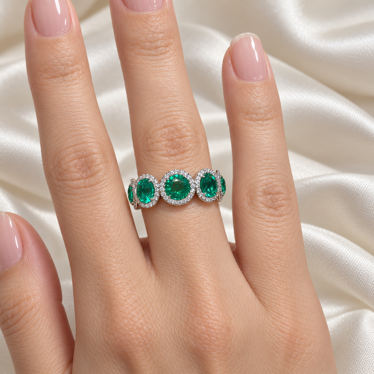Lab-grown emerald diamond halo band, hand view
