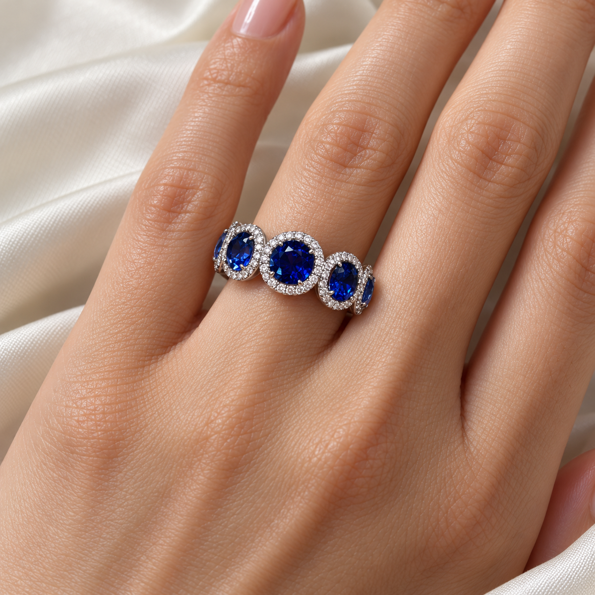 Lab-grown sapphire diamond halo band, hand view