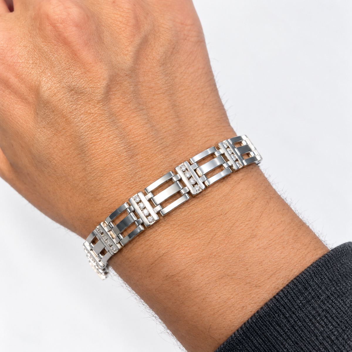 Men's 14K white gold diamond link bracelet worn on the wrist