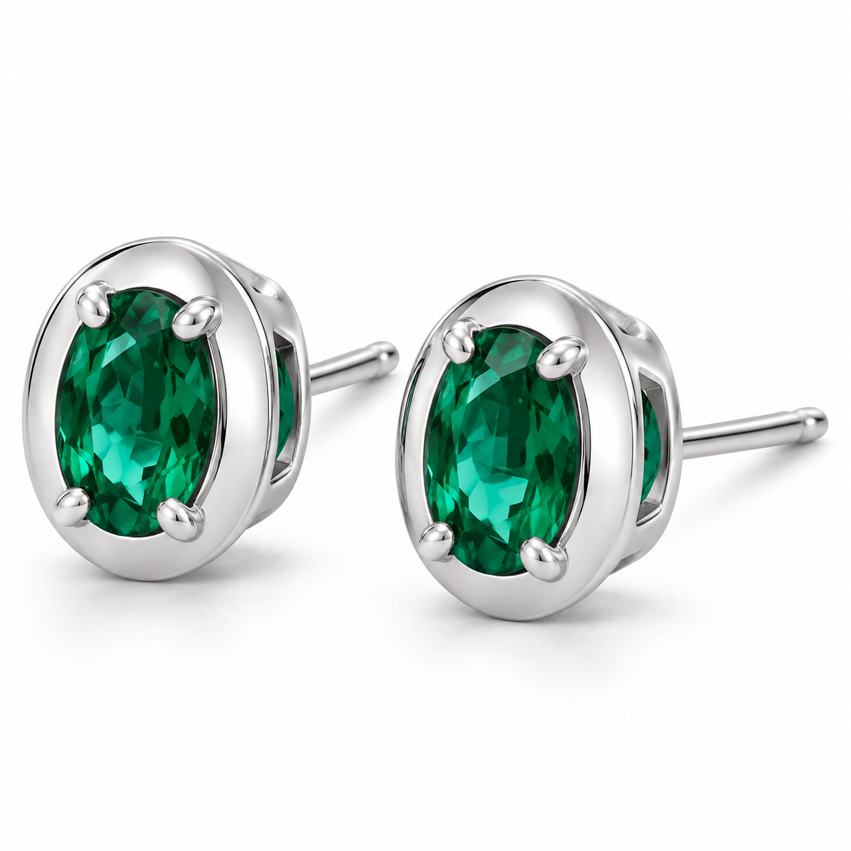 14K White Gold Lab-Grown Emerald Oval Claw Bezel Stud Earrings — enhanced studio view, 6 × 4 mm stones