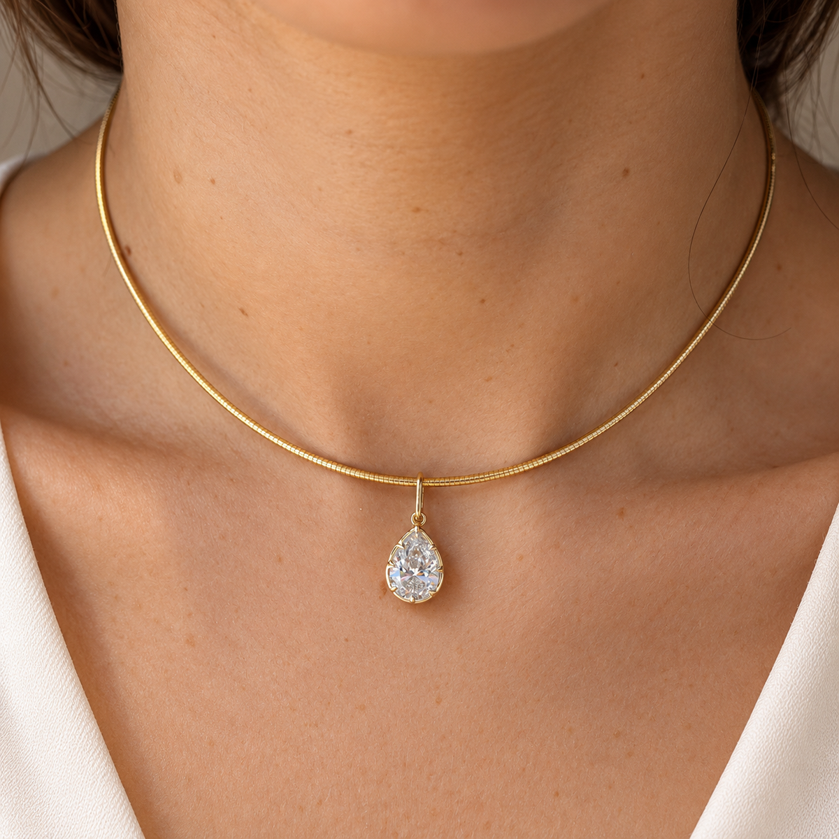 Pear diamond omega necklace worn on body