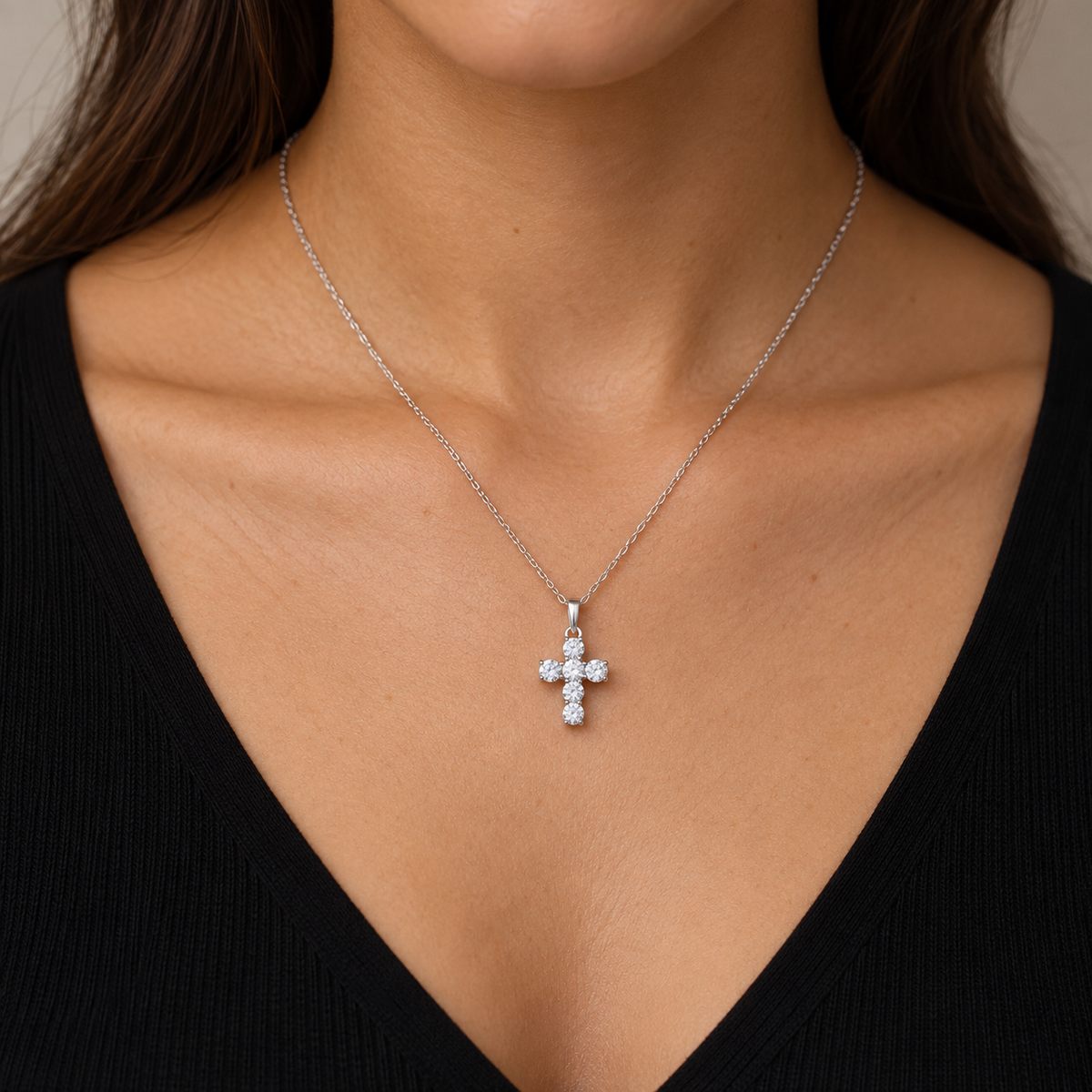 0.25 CTW six-diamond cross necklace in 14K white gold — on-body styling illustration