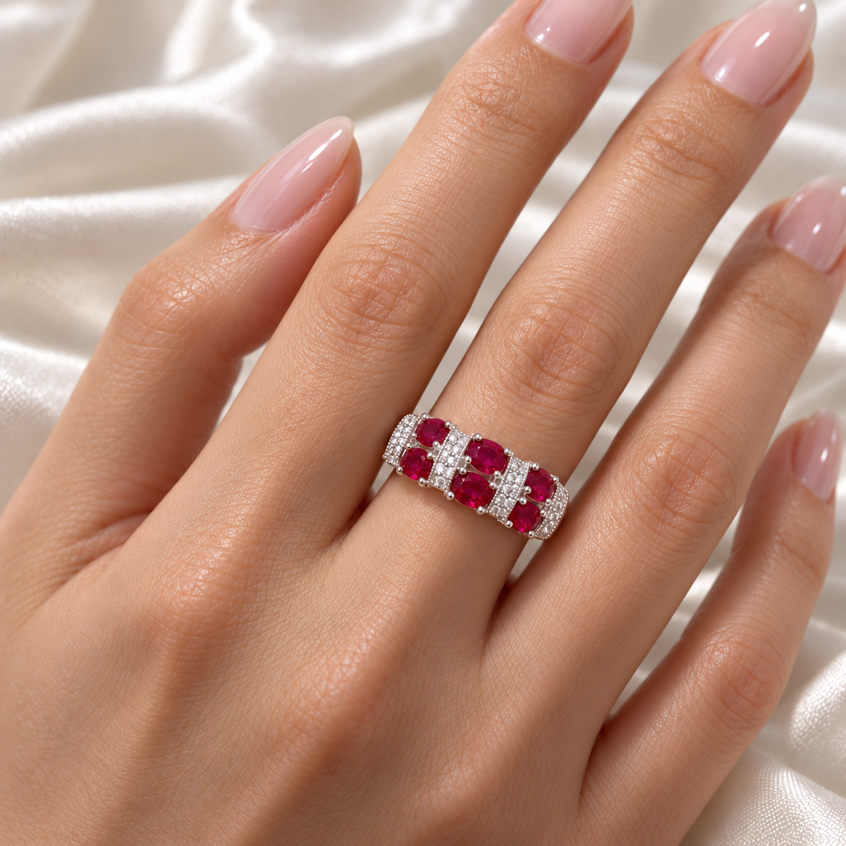 Oval ruby and diamond band in 14K white gold, hand view