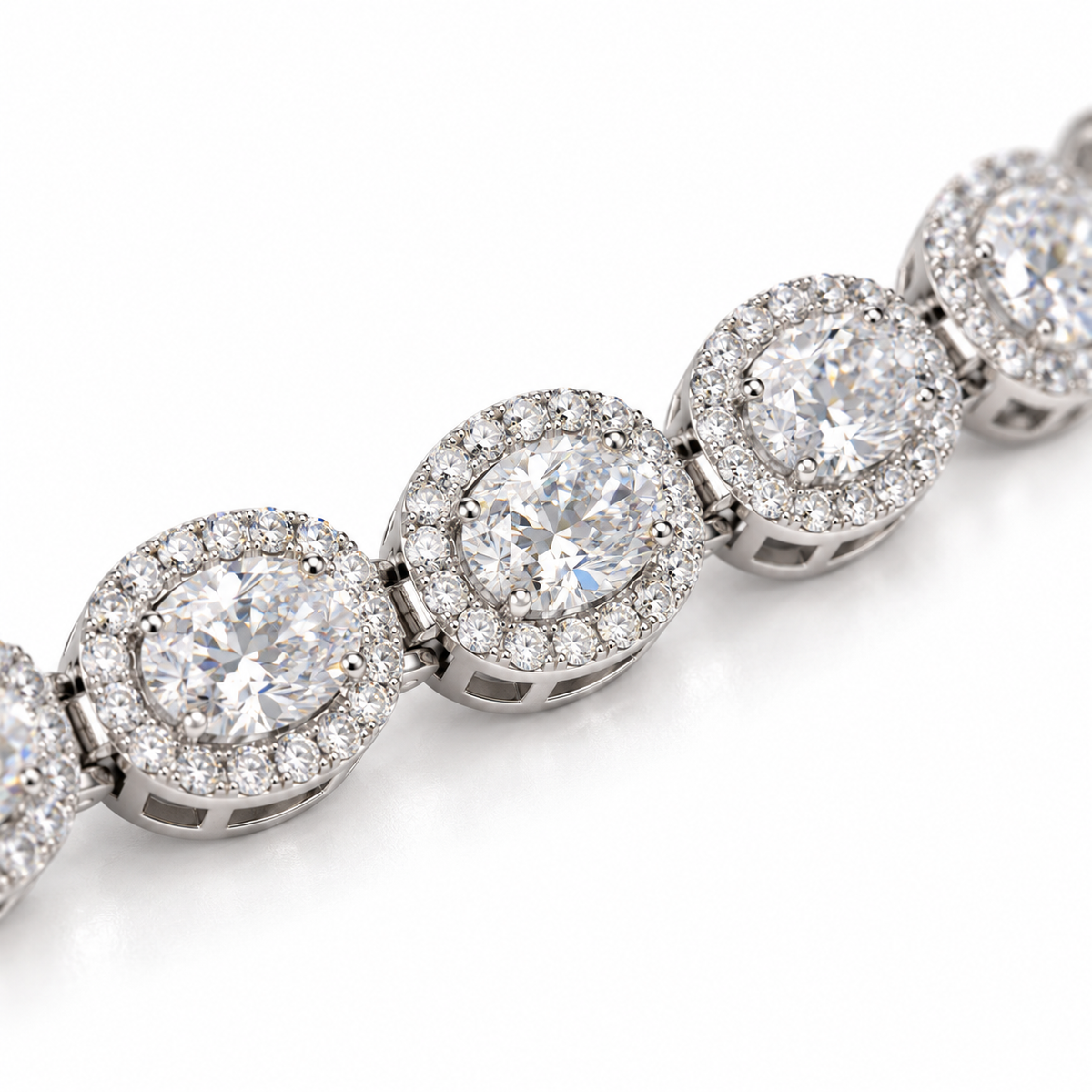 Close-up of oval center diamonds and diamond halos in white gold settings