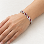 Women's emerald-cut lab-grown ruby and diamond halo bracelet in 14K white gold — on wrist