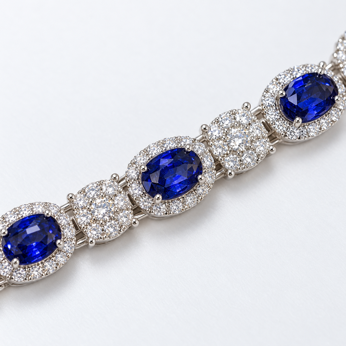 Close-up of blue oval lab-grown sapphire halos and lab-grown diamond links