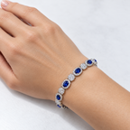 Oval lab-grown sapphire and diamond bracelet on a woman's wrist